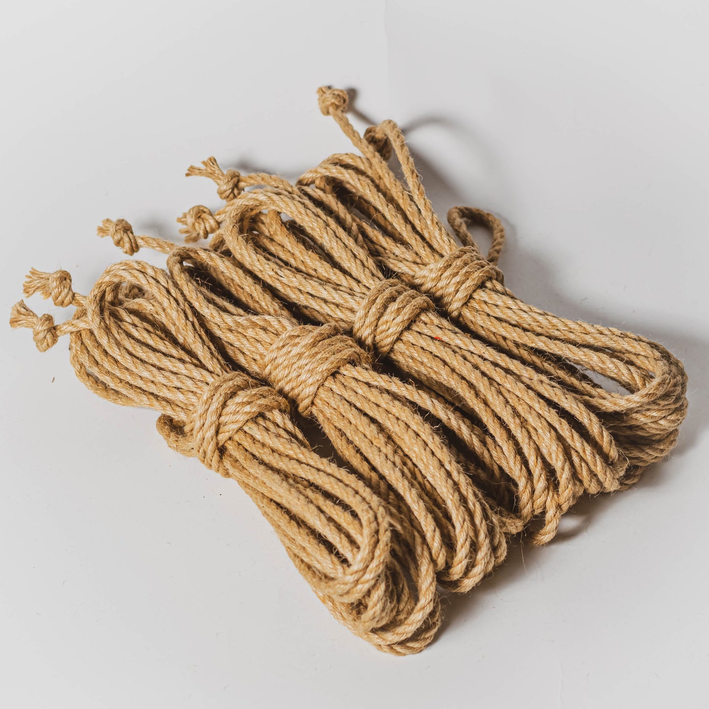 https://shibaristore.com/cdn/shop/products/raw-6mm-jute-rope-shibari-rope-4-ropes-no-goo-115150.jpg?v=1662582874&width=1445