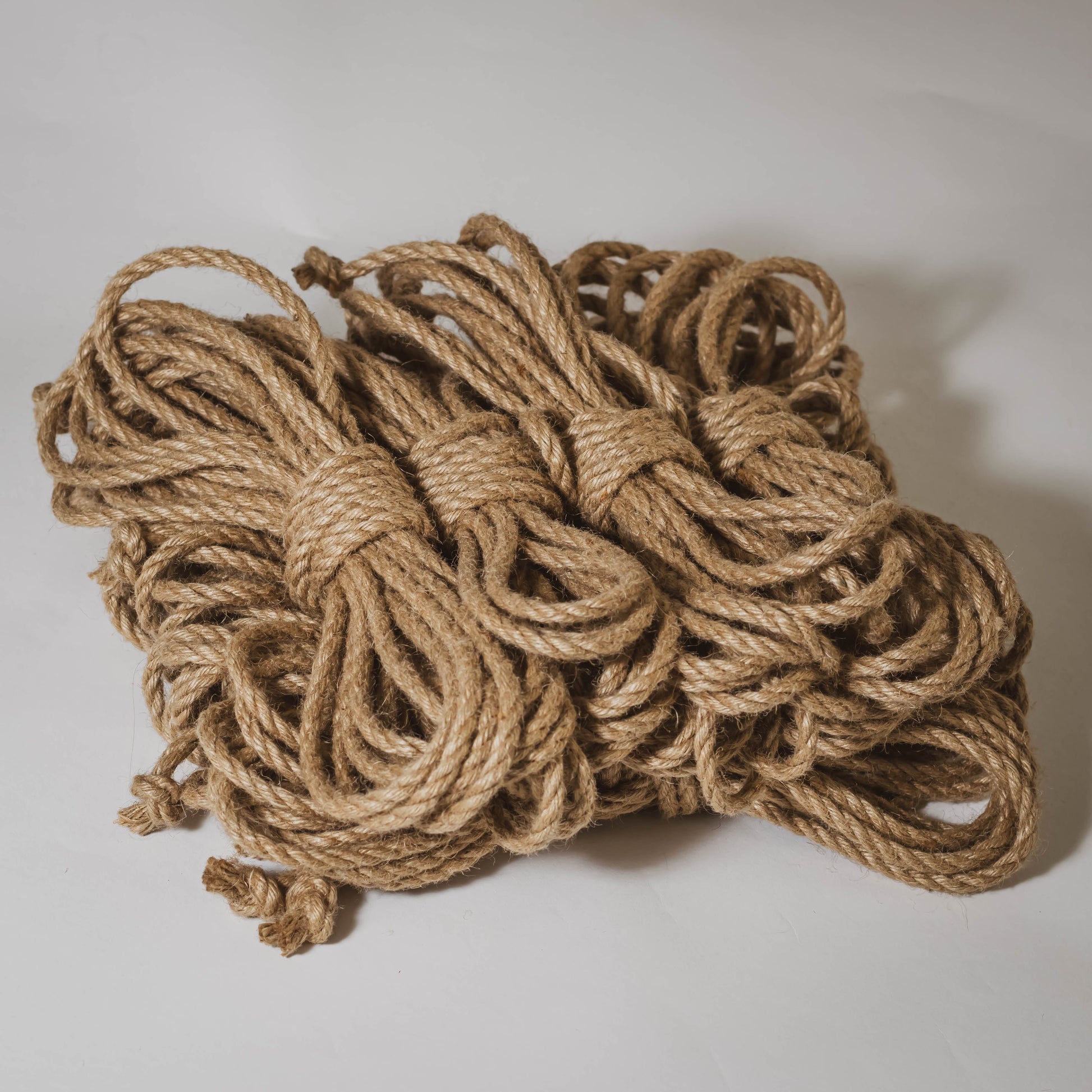 https://shibaristore.com/cdn/shop/products/untreated-6mm-jute-rope-shibari-rope-bundle-of-8-713096.jpg?v=1624217957&width=1946